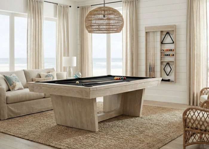 Modern pool table in whitewashed oak with black cloth in a bright coastal game room