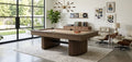 Brunswick Rayburn pool table in walnut with a fluted pedestal base, surrounded by bright, modern decor